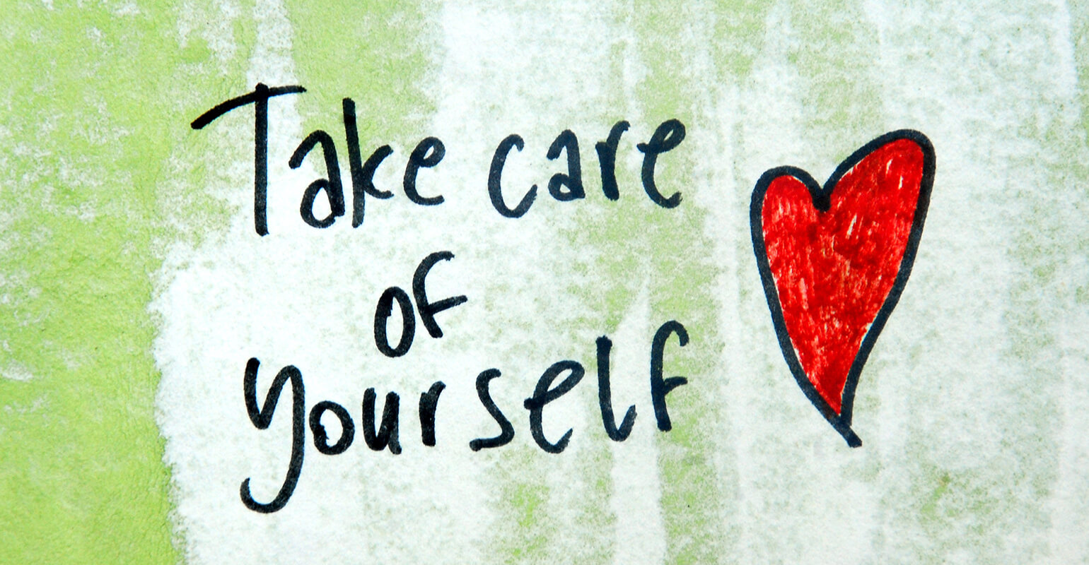 The words 'take care of yourself' hand-written on a green and white background. To the right of the words is a hand-drawn, red heart.